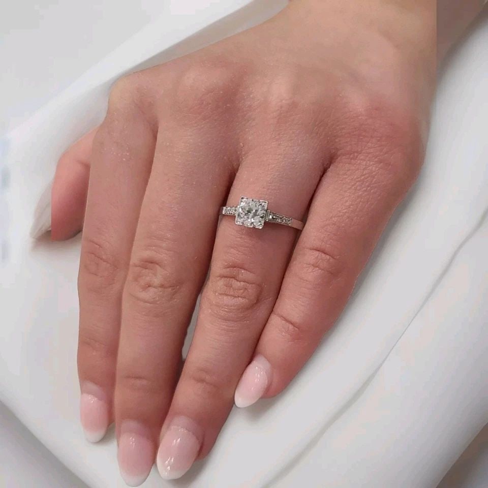 PLATINUM VINTAGE FILIGREE ENGAGEMENT RING 0.78CT. NATURAL EURO CUT ROUND DIAMOND: PLATINUM VINTAGE FILIGREE ENGAGEMENT RING 0.78CT. NATURAL EURO CUT ROUND DIAMOND This stunning platinum engagement ring showcases a natural, round diamond with a Euro cut and a total carat weight of 0