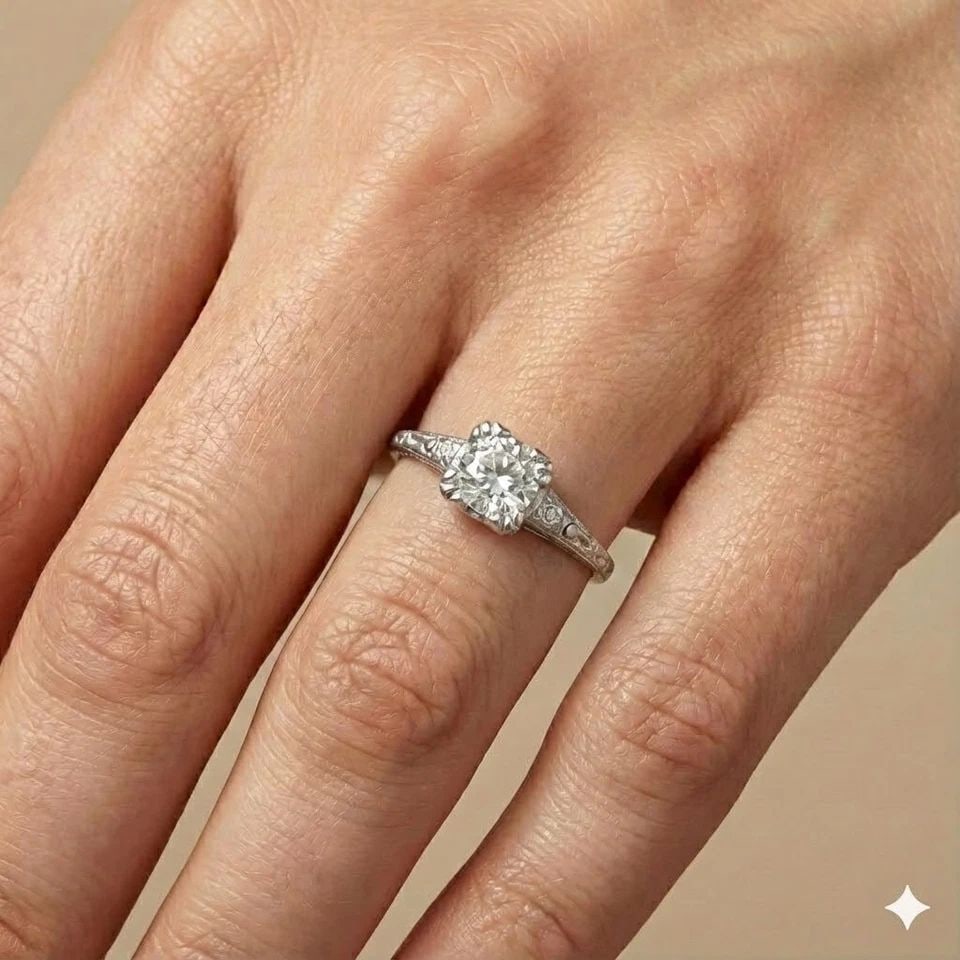 PLATINUM VINTAGE ENGAGEMENT RING 0.62CT.NATURAL OLD EURO ROUND DIAMOND 1920'S: PLATINUM VINTAGE ENGAGEMENT RING 0.62CT.NATURAL OLD EURO ROUND DIAMOND 1920'S This authentic Art Deco engagement ring from the 1920s features a 0.62ct natural Old European–cut round diamond set in s