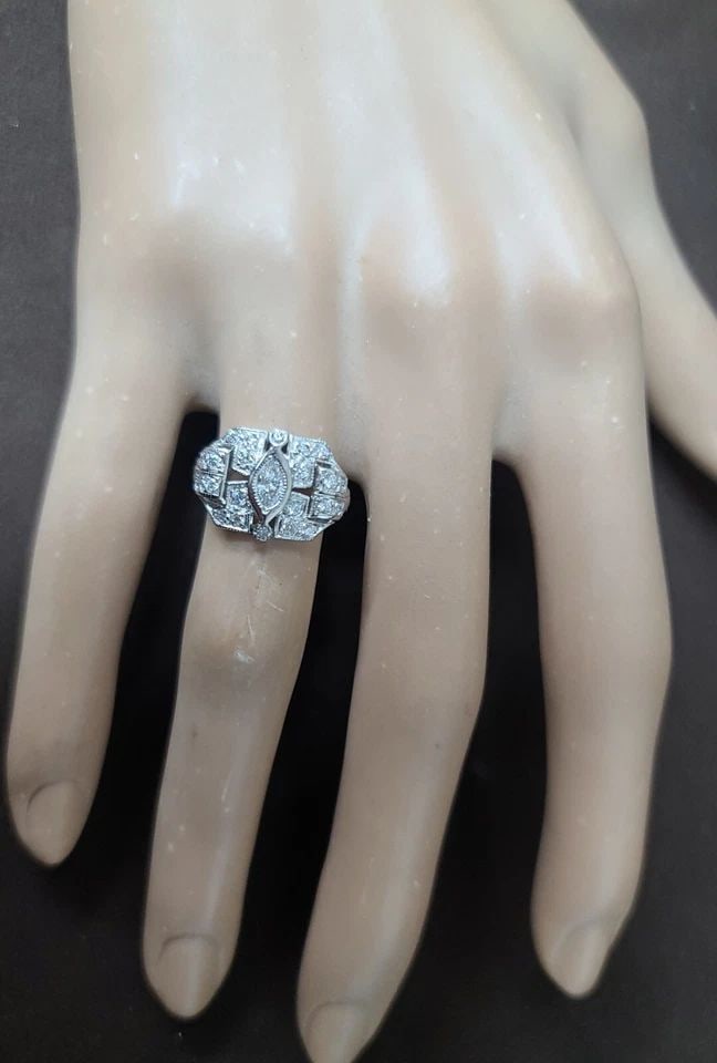 VINTAGE FILIGREE PLATINUM RING O.52CT. NATURAL MARQUISE DIAMOND CIRC 1930'S: 0.52CT VINTAGE FILIGREE PLATINUM RING NATURAL MARQUISE DIAMOND SI1-H This beautiful vintage ring is a timeless piece of jewelry that will make any occasion special. The ring features a stunning marqui