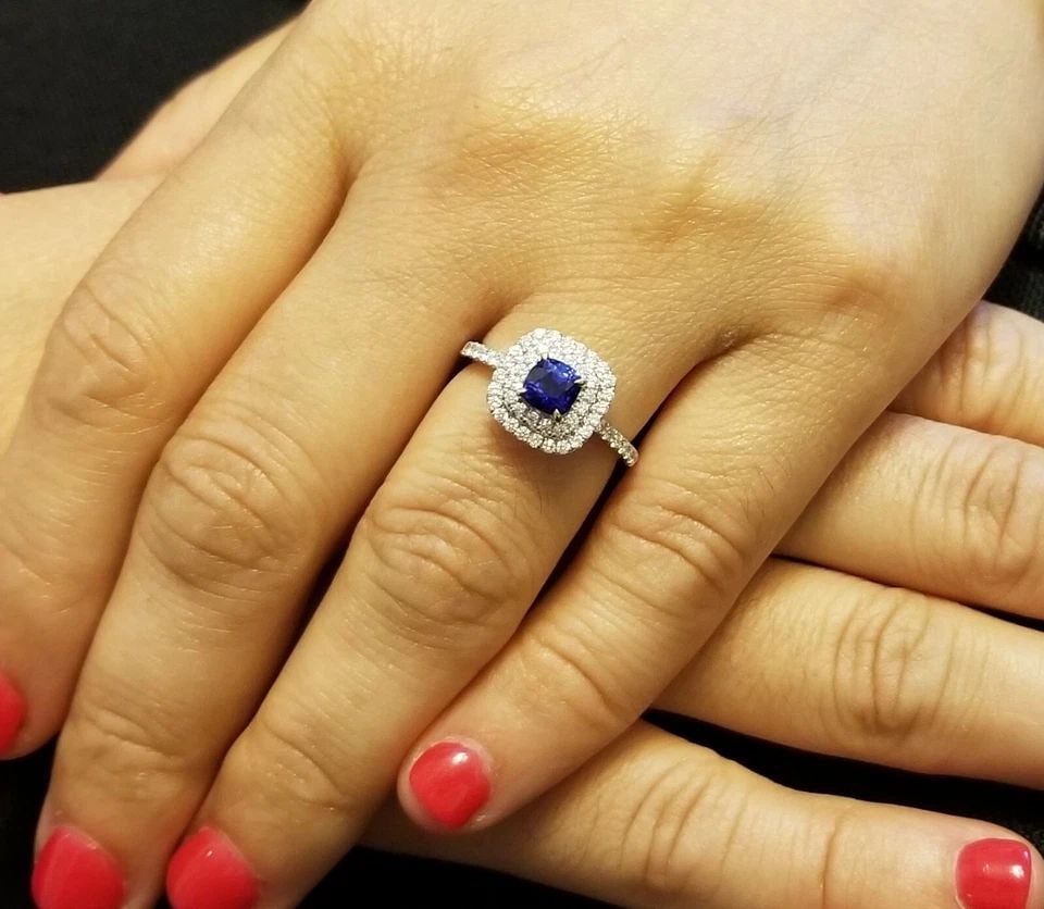 18K WHITE GOLD ENGAGEMENT RING 1.37CT. NATURAL SAPPHIRE CUSHION SHAPE: 18K WHITE GOLD ENGAGEMENT RING 1.37CT. NATURAL SAPPHIRE CUSHION SHAPE GORGEOUS 18K WHITE GOLD natural heated blue Sapphire cushion shape center weight 0.85ct. size 5mm very nice rich royal blue color 