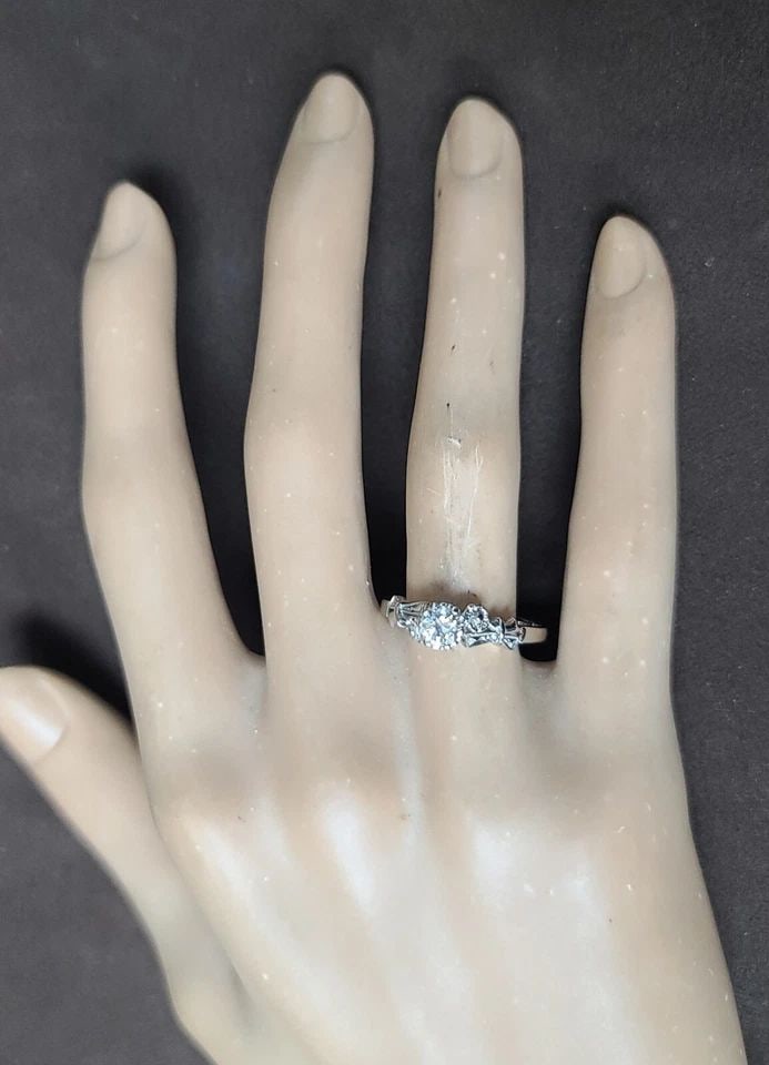 PLATINUM VINTAGE FILIGREE ENGAGEMENT RING 0.38CT. NATURAL OLD EURO CUT DIAMOND: PLATINUM VINTAGE FILIGREE ENGAGEMENT RING 0.38CT. NATURAL OLD EURO CUT DIAMOND This stunning vintage engagement ring is a true beauty. Crafted from platinum, it features a round old Euro cut diamond w