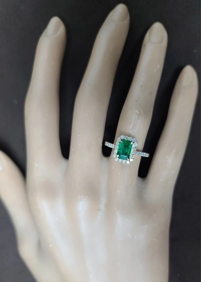 14K YELLOW ENGAGEMENT RING 1.14CT. NATURAL GREEN EMERALD RECTANGULAR SHAPE: 14K YELLOW ENGAGEMENT RING 1.14CT. NATURAL GREEN EMERALD RECTANGULAR SHAPE This stunning engagement band features a beautiful 1.14ct natural green emerald in a rectangular shape, set in a 14k yellow g