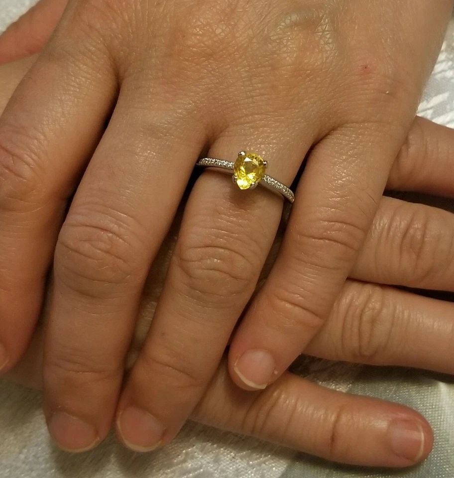 18K WHITE GOLD ENGAGEMENT RING 1.43CT. NATURAL YELLOW SAPPHIRE PEAR SHAPE: 18K WHITE GOLD ENGAGEMENT RING 1.43CT. NATURAL YELLOW SAPPHIRE PEAR SHAPE GORGEOUS 18K white GOLD natural yellow Sapphire in pear shape Center weight 1.43ct. size 8x7mm very nice rich yellow canary co