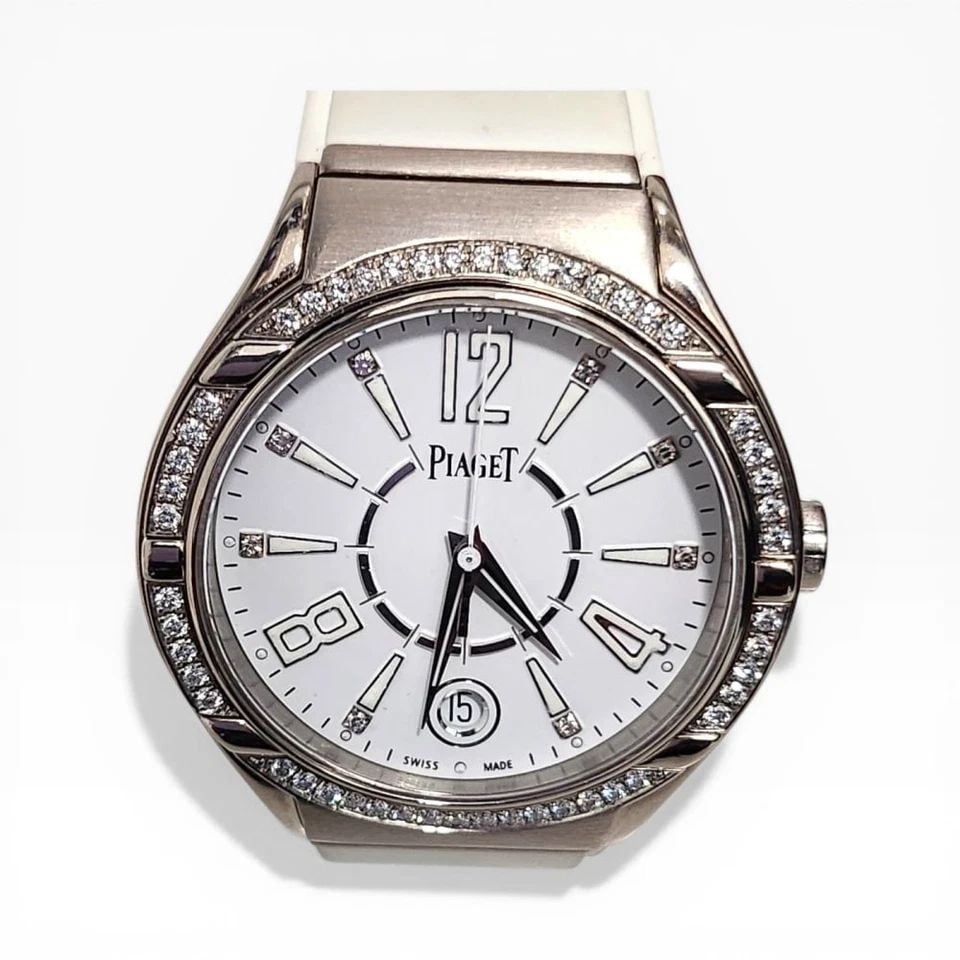 PIAGET POLO LADIES 38 MM 18K WHITE GOLD DIAMOND RUBBER STRAP QUARTZ WATCH: PIAGET POLO LADIES 38 MM 18K WHITE GOLD DIAMOND RUBBER STRAP QUARTZ WATCH Manufacturer Piaget Category Polo Reference Number P10726 Band Type Rubber Bezel Diamonds Bezel Box No Case Mes 38 mm Case Typ