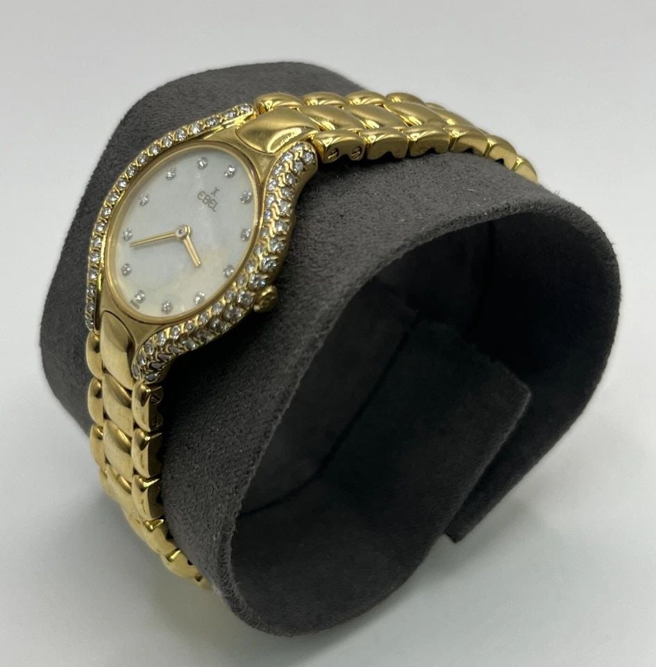 EBEL BELUGA 18K GOLD 24MM DIAMOND WATCH BRACELET W/ MOTHER OF PEARL DIAL 866969: EBEL BELUGA 18K GOLD 24MM DIAMOND WATCH BRACELET W/ MOTHER OF PEARL DIAL 866969 EBEL BELUGA 18K GOLD 24MM DIAMOND WATCH BRACELET W/ MOTHER OF PEARL DIAL 866969 This stunning Ebel Beluga wristwatch is 
