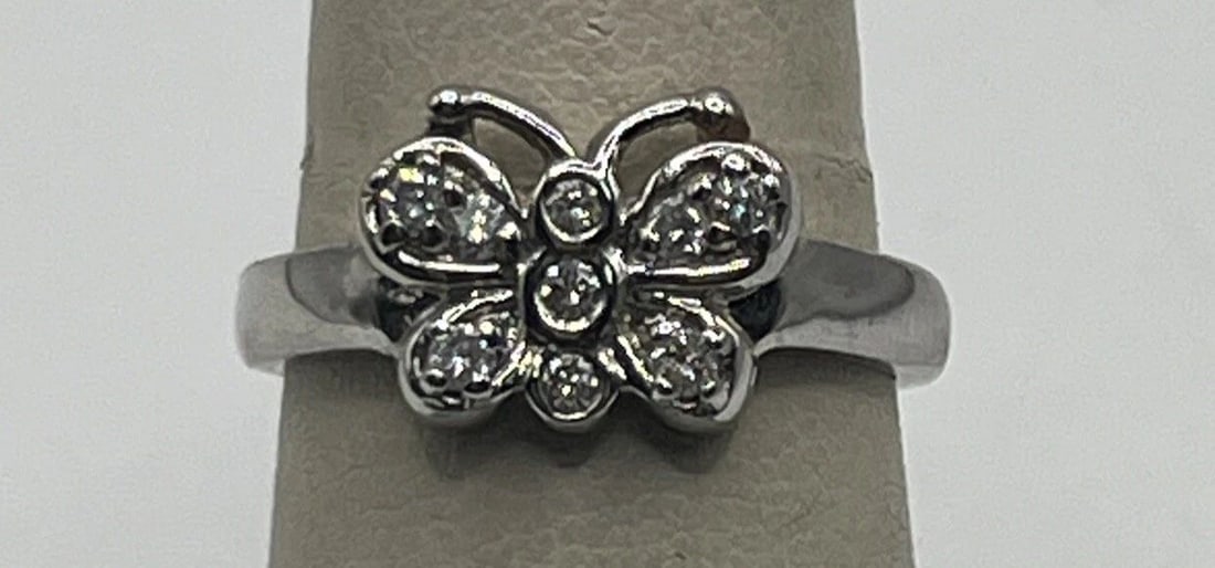 14K WHITE GOLD & DIAMOND BUTTERFLY RING SIZE 7: 14K WHITE GOLD & DIAMOND BUTTERFLY RING SIZE 7 14K WHITE GOLD & DIAMOND BUTTERFLY RING SIZE 7 This stunning butterfly ring is a must-have for any jewelry collection. Crafted from 14k white gold, this