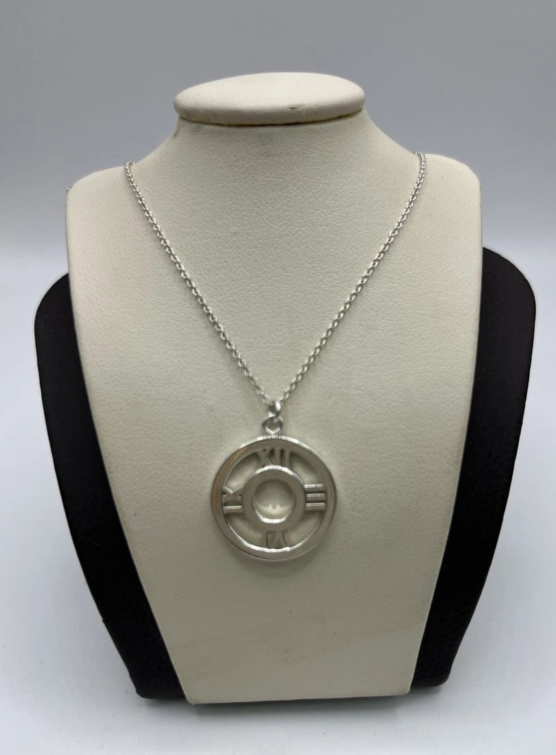 TIFFANY & CO SILVER ROUND CIRCLE ATLAS NECKLACE CHARM PENDANT: TIFFANY & CO SILVER ROUND CIRCLE ATLAS NECKLACE CHARM PENDANT TIFFANY & CO SILVER ROUND CIRCLE ATLAS NECKLACE CHARM PENDANT Tiffany & Co Silver Round Circle Atlas Necklace Charm PendantChain is 16