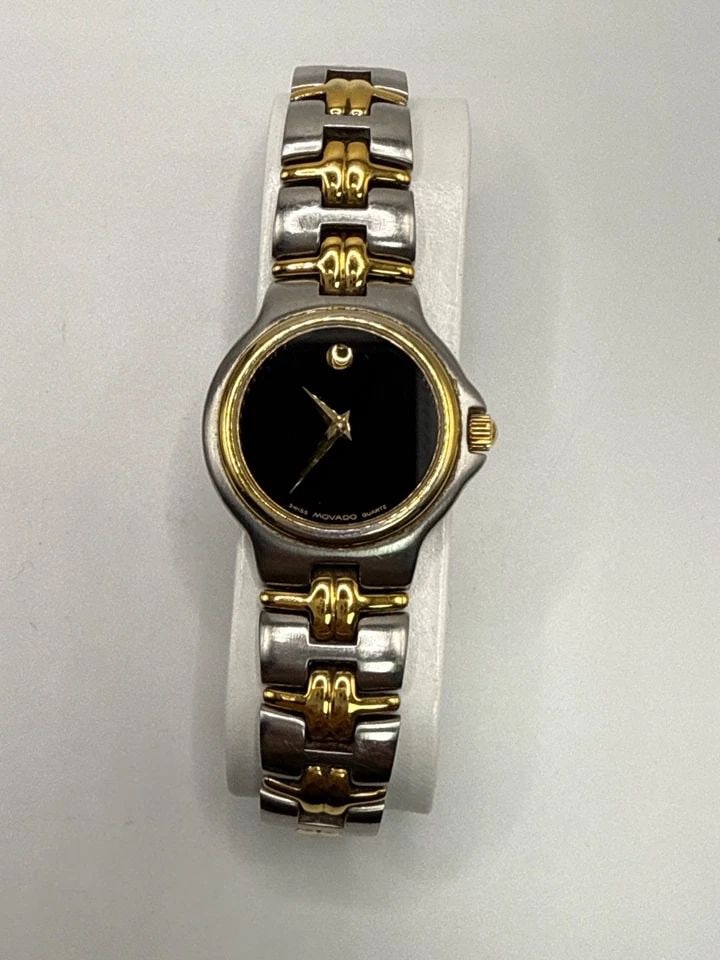 MOVADO MUSEUM LADIES WATCH 2-TONE 81.A1.827.2 QUARTZ: MOVADO MUSEUM LADIES WATCH 2-TONE 81.A1.827.2 QUARTZ The Movado Ladies 2-Tone Stainless Steel Black Dial 81.A1.827.2 Swiss Quartz Watch is a classic timepiece designed for women. Featuring a sleek rou