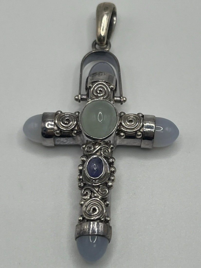 PRINCESS DIANA STYLE SAJEN STERLING SILVER LAVENDER MOONSTONE TOPAZ CROSS: Princess Diana Style Sajen Sterling Silver Lavender Moonstone Topaz Cross This exquisite pendant from Sajen is a must-have for any jewelry collection. Crafted in 925 sterling silver, it features a bea