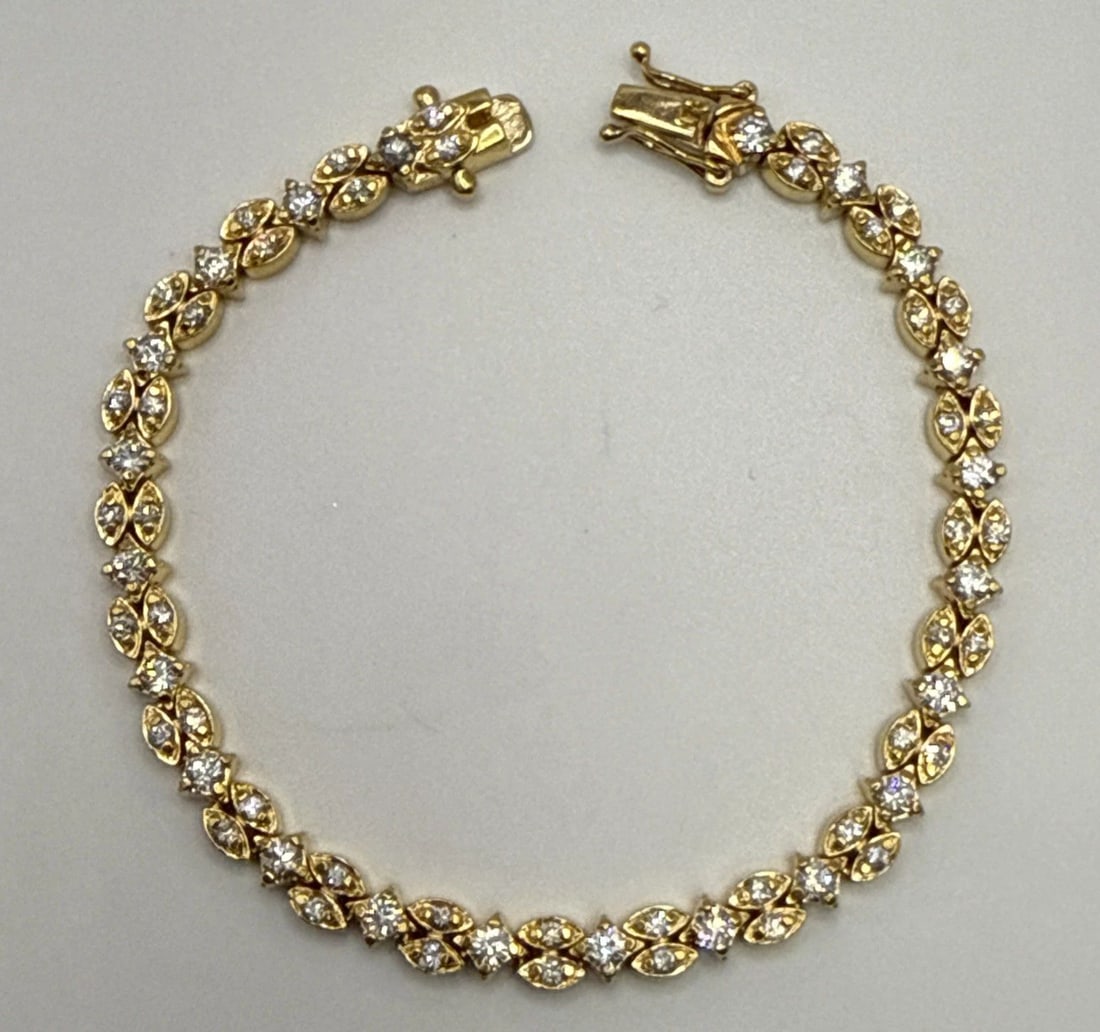 7.5" GOLD COLORED 925 BRACLET WITH COLORLESS STONES (1 of 2)