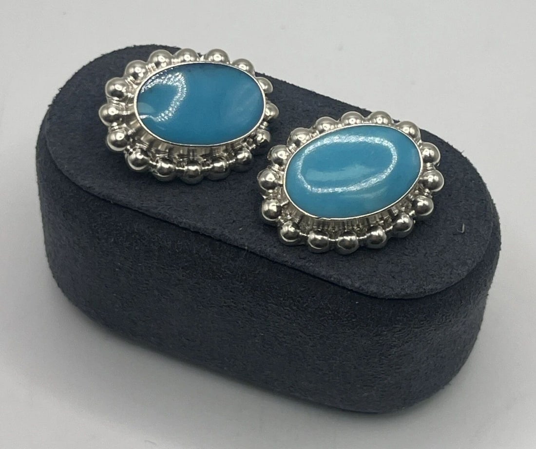 TURQUOISE & STERLING SILVER CLIP-ON EARRINGS: TURQUOISE & STERLING SILVER CLIP-ON EARRINGS TURQUOISE & STERLING SILVER CLIP-ON EARRINGS These are Mexican-style clip-on earrings made of 925 sterling silver, featuring a statement design with turquo