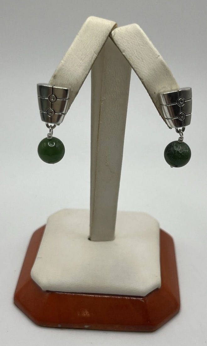STERLING SILVER AND JADE EARRINGS: STERLING SILVER AND JADE EARRINGS STERLING SILVER AND JADE EARRINGS Elevate your jewelry collection with these stunning Sterling Silver and Jade Earrings. Crafted from the finest quality 925 sterling 