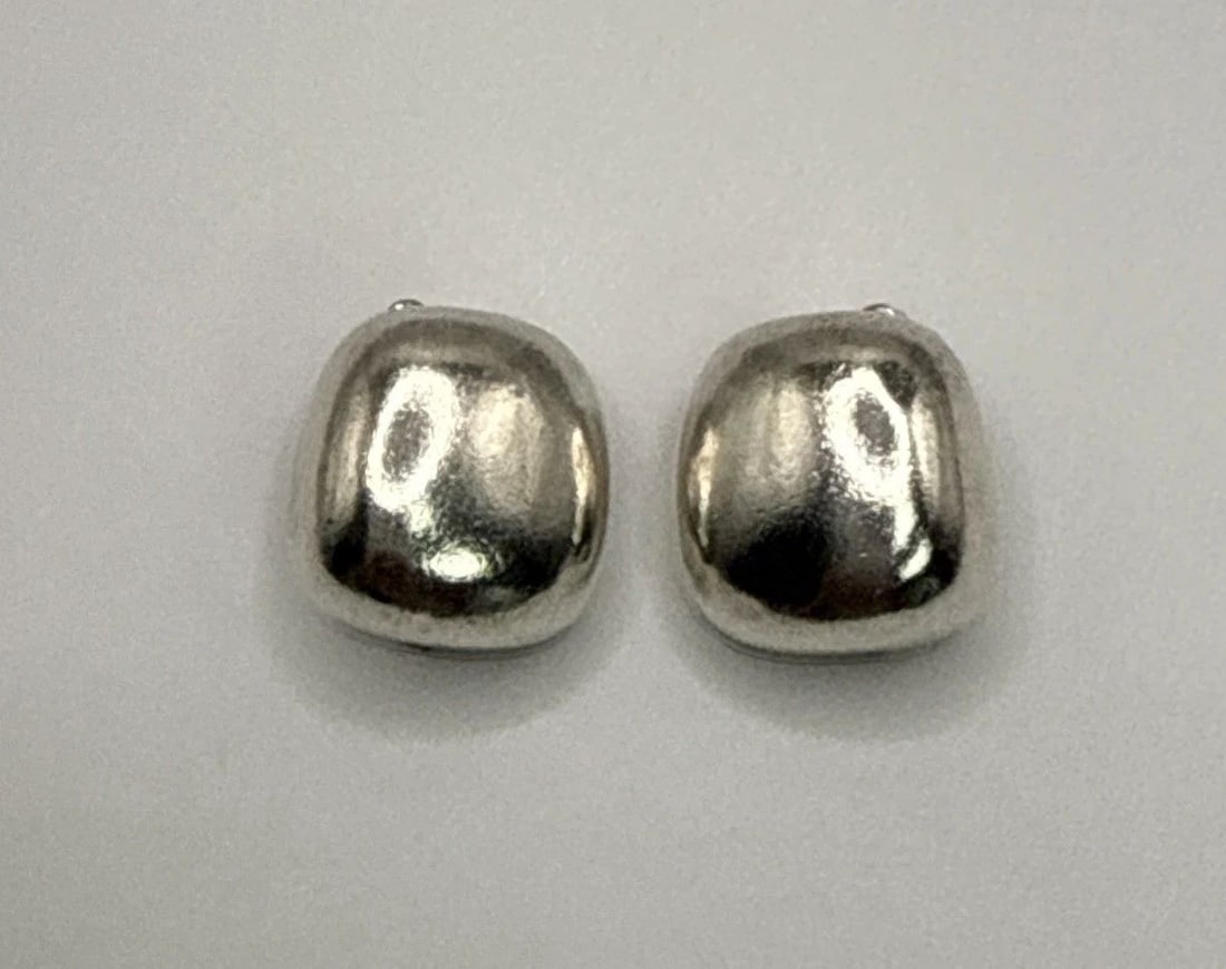 STERLING SILVER SQUARE CLIP-ON EARRINGS The Sterling Silver Square Clip-On Earrings are a stylish: The Sterling Silver Square Clip-On Earrings are a stylish and classic accessory perfect for adding a touch of sophistication to any outfit. Made from 925 sterling silver, these stud earrings feature a