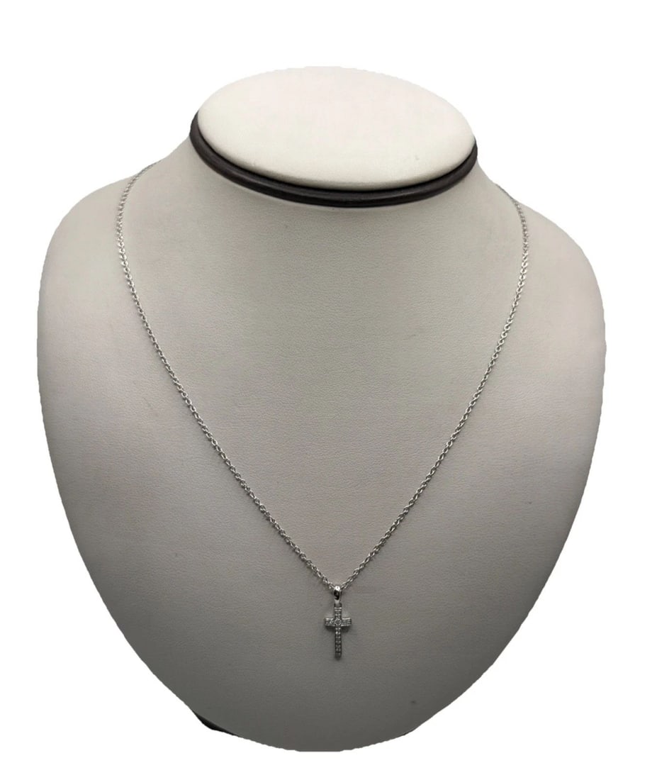 STERLING SILVER CROSS WITH COLORLESS STONES ON ADJUSTABLE 16" & 18" CHAIN: Sterling Silver Cross with Colorless Stones on Adjustable 16" & 18" Chain This Sterling Silver Cross pendant features colorless stones set on an adjustable 16" and 18" chain. The pendant shape is a cr