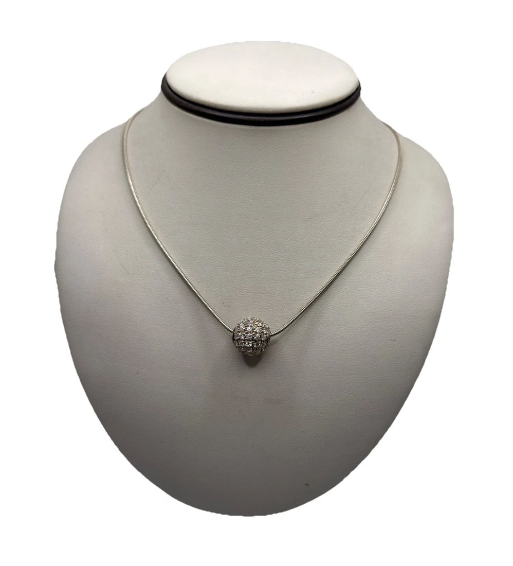 19" STERLING SILVER SNAKE CHAIN WITH COLORLESS STONE BALL CHARM: 19" STERLING SILVER SNAKE CHAIN WITH COLORLESS STONE BALL CHARM 19" STERLING SILVER SNAKE CHAIN WITH COLORLESS STONE BALL CHARM Crafted with precision, this 19-inch sterling silver snake chain is a te