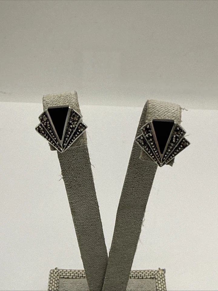 ART DECO STERLING SILVER, MARCASITE & ONYX STUD EARRINGS: ART DECO STERLING SILVER, MARCASITE & ONYX STUD EARRINGS These Art Deco sterling silver stud earrings feature marcasite and onyx stones in a classic black color. The intricate design and high-quality 