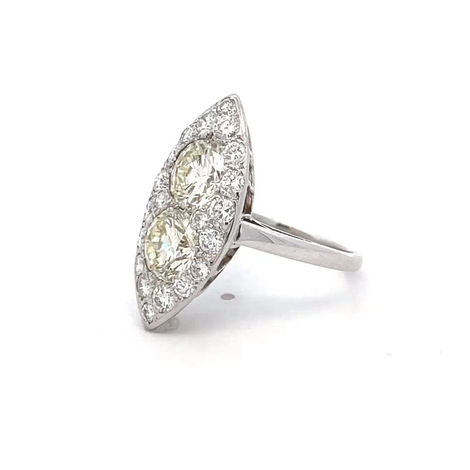 VINTAGE DOUBLE SOLITAIRE DIAMONDS 14K WHITE GOLD MARQUISE COCKTAIL RING: VINTAGE DOUBLE SOLITAIRE DIAMONDS 14K WHITE GOLD MARQUISE COCKTAIL RING This stunning marquise shape ring is finely crafted from 14k white gold with a fine polished finish featuring a gorgeous two rou