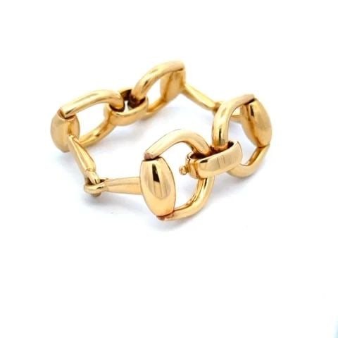 GUCCI EQUESTRIAN BRACELET LARGE HORSE BIT LINK IN 18K YELLOW GOLD: GUCCI EQUESTRIAN BRACELET LARGE HORSE BIT LINK IN 18K YELLOW GOLD This is a gorgeous authentic chic bracelet by Gucci, it is crafted from 18k yellow gold with a fine polished finish featuring 4 large 