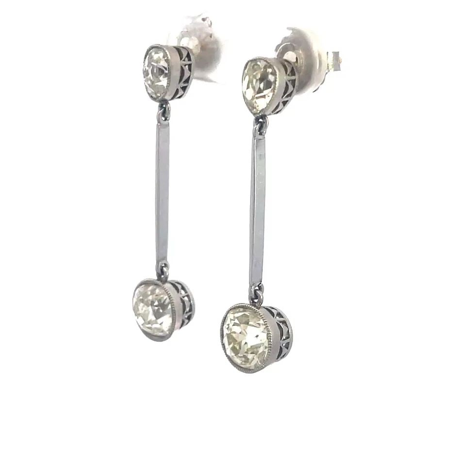 VICTORIAN DIAMOND PLATINUM EARRINGS 5CT DANGLE STYLE GOLD POSTS: VICTORIAN DIAMOND PLATINUM EARRINGS 5CT DANGLE STYLE GOLD POSTS From the Victorian Era, these lovely dangle earrings are crafted from platinum with gold post and backs. The top is an oval shape frame 