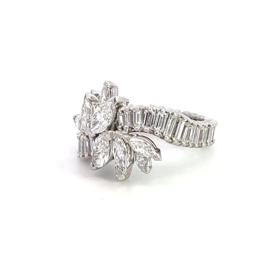 PLATINUM 4.5CT DIAMOND FLORAL STYLE COCKTAIL RING SIZE 6: PLATINUM 4.5CT DIAMOND FLORAL STYLE COCKTAIL RING SIZE 6 This is a stunning floral design diamond ring, crafted from platinum with a polished finish featuring a tapered curved shape band set with bagu