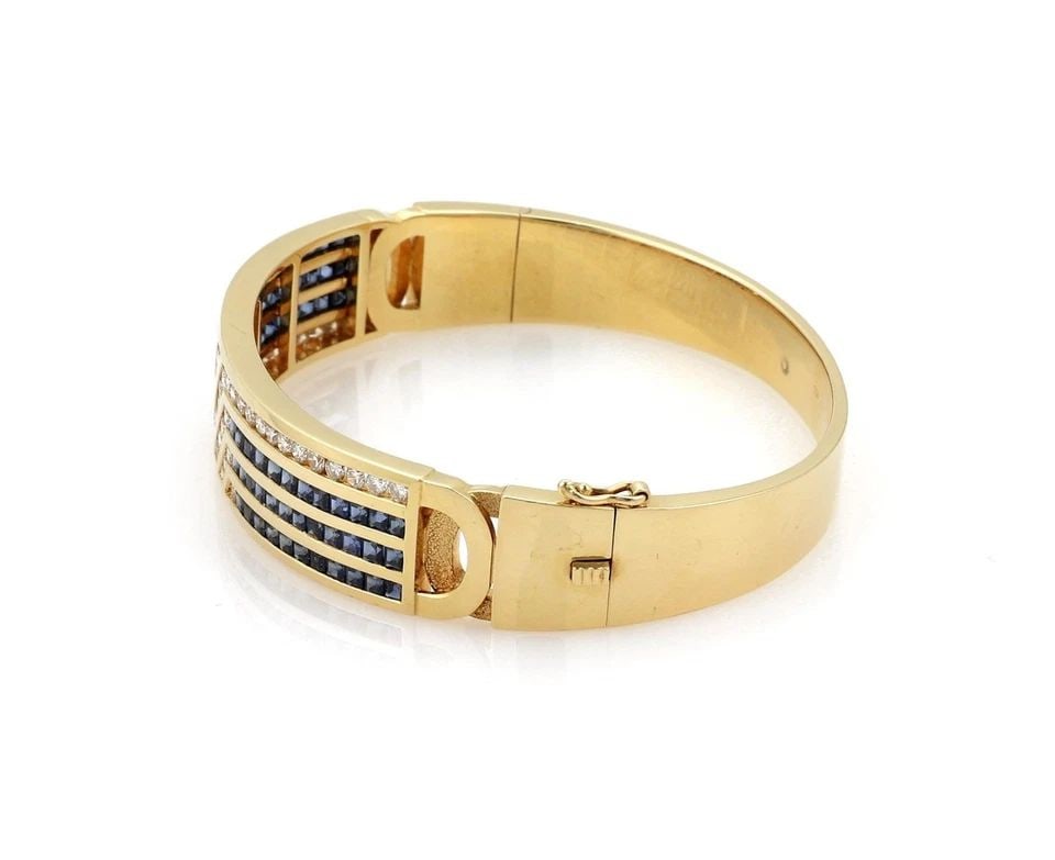 ESTATE 7 CARATS DIAMOND & SAPPHIRE 18K YELLOW GOLD WIDE BRACELET LIQUIDATION: ESTATE 7 CARATS DIAMOND & SAPPHIRE 18K YELLOW GOLD WIDE BRACELET Estate 7 Carats Diamond & Sapphire 18k Yellow Gold Wide Bracelet Description This is an elegant yellow gold, diamonds and blue sapphire