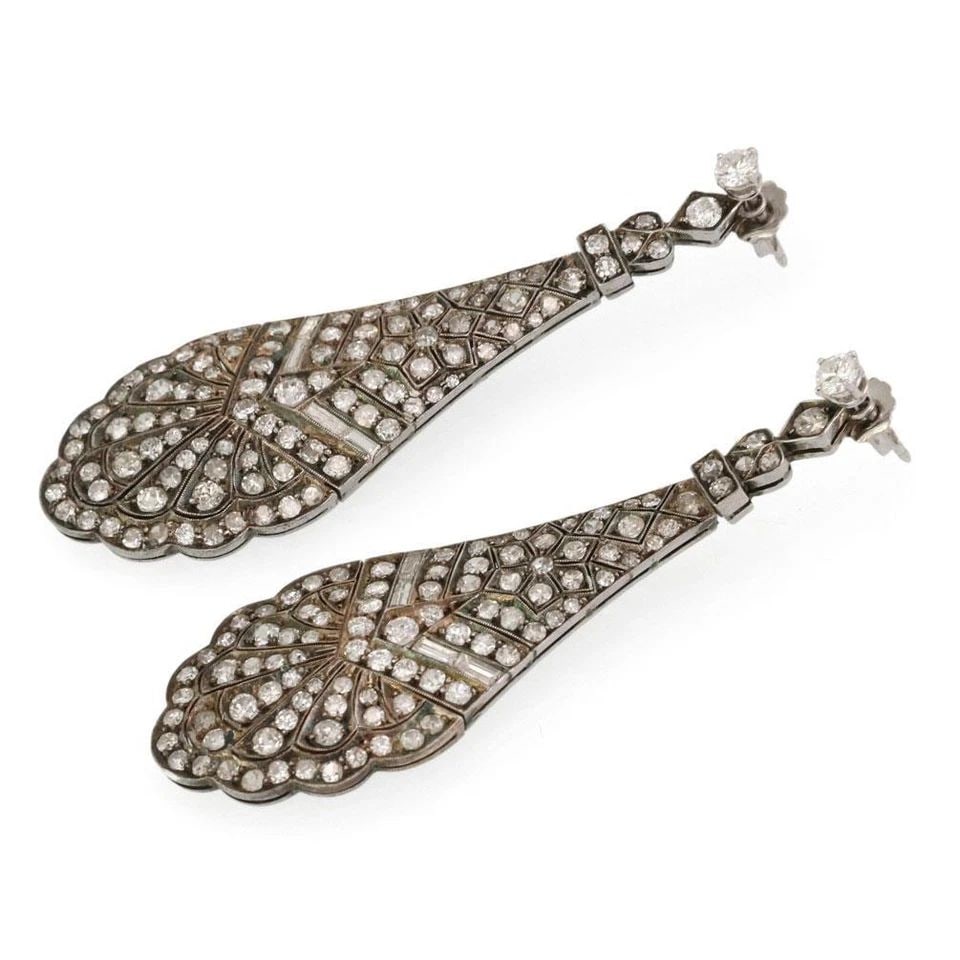 ANTIQUE 5.00CT DIAMOND SILVER MILGRAIN LONG CHANDELIER EARRINGS LIQUIDATION: ANTIQUE 5.00CT DIAMOND SILVER MILGRAIN LONG CHANDELIER EARRINGS Antique 5.00ct Diamond Silver Milgrain Long Chandelier Earrings Description These gorgeous antique earrings are crafted from sterling si