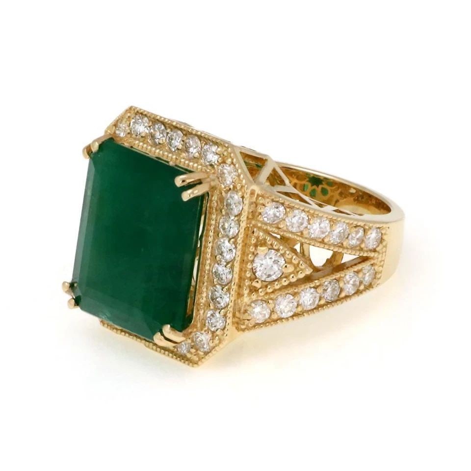 DIAMOND EMERALD RING 14K YELLOW GOLD COCKTAIL STYLE: DIAMOND EMERALD RING 14K YELLOW GOLD COCKTAIL STYLE Stunning Diamond Emerald 14k Yellow Gold Cocktail Ring Description This is a large impressive cocktail ring, it is crafted from 14k yellow gold feat