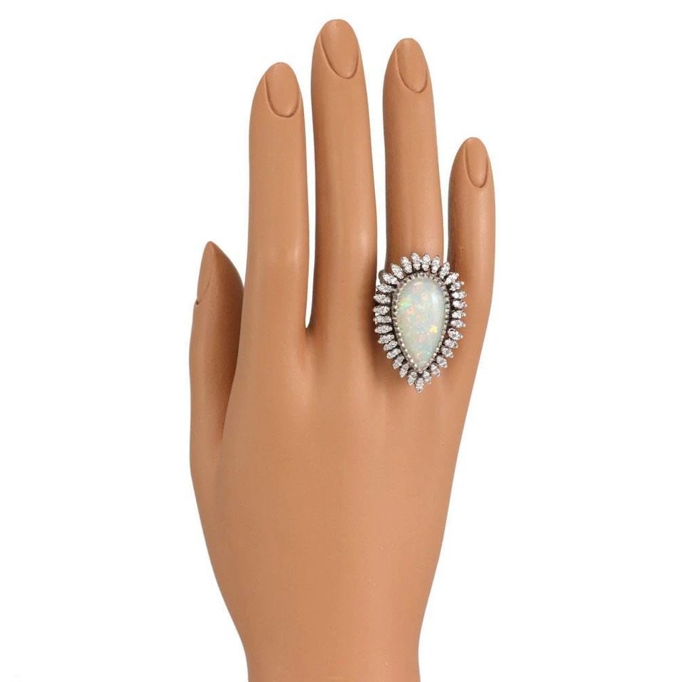 VINTAGE 14.00CT FIRE OPAL DIAMOND 14K WHITE GOLD COCKTAIL RING LIQUIDATION: VINTAGE 14.00CT FIRE OPAL DIAMOND 14K WHITE GOLD COCKTAIL RING Vintage 14.00ct Fire Opal Diamond 14k White Gold Cocktail Ring Description This large eye catching vintage ring is crafted from 14k white