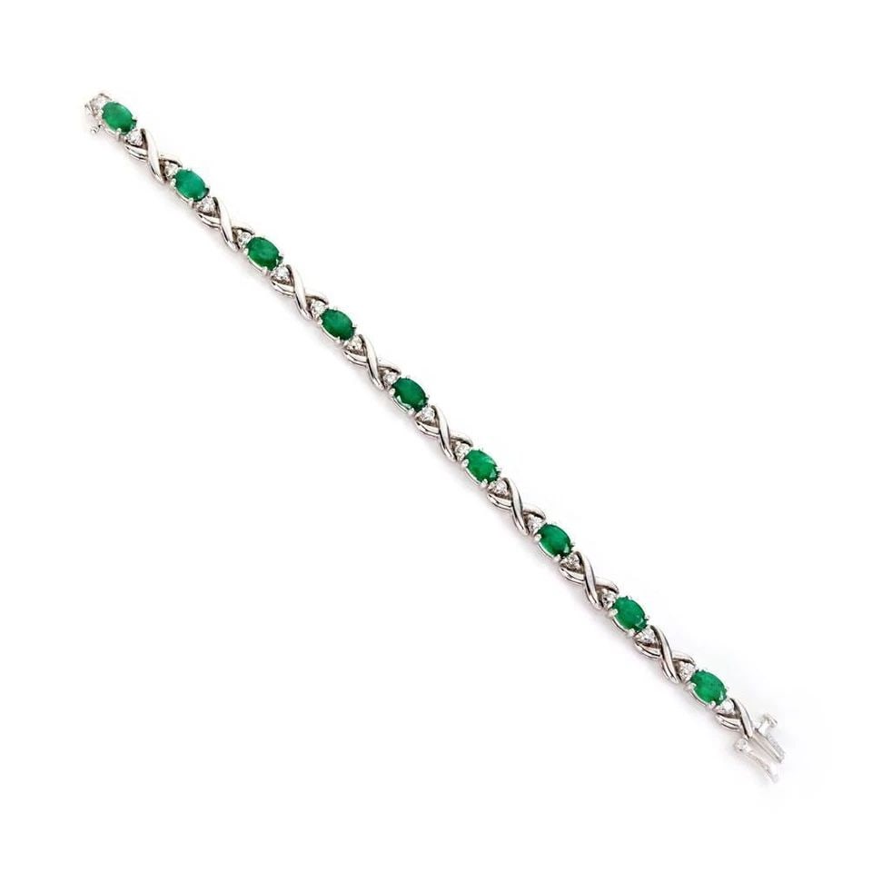 14K WHITE GOLD 9.90CT EMERALD & DIAMOND X LINK BRACELET LIQUIDATION!: 14K WHITE GOLD 9.90CT EMERALD & DIAMOND X LINK BRACELET ! 14k White Gold 9.90ct Emerald & Diamond X Link Bracelet ! Description This elegant bracelet is crafted from 14k white gold with a polished fin