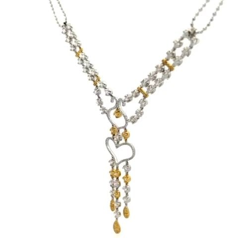GOLD DOUBLE NECKLACE HEART 18K PENDANT DIAMOND OPEN DELICATE DESIGN: GOLD DOUBLE NECKLACE HEART 18K PENDANT DIAMOND OPEN DELICATE DESIGN This is a lavish two tone 18k gold, fancy yellow and white diamonds ladies cocktail necklace. The piece is exquisitely crafted in 18