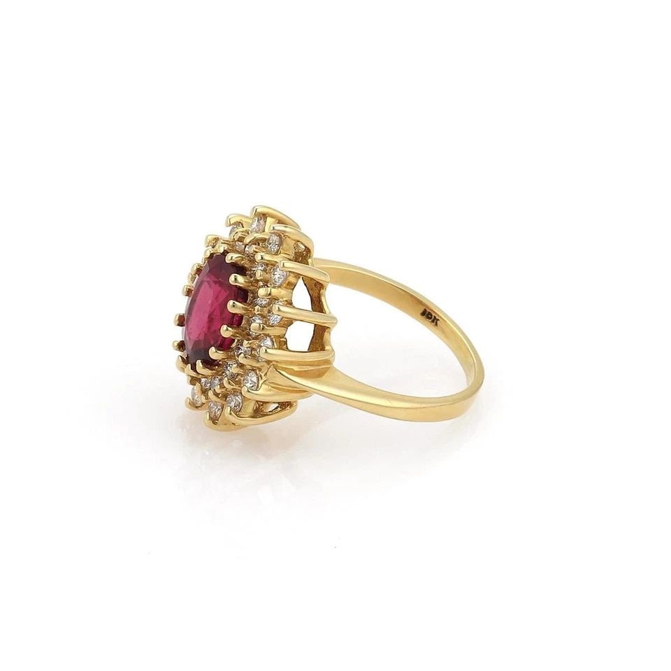 DIAMOND RED GEMSTONE RING GOLD 18K YELLOW COCKTAIL RING: DIAMOND RED GEMSTONE RING GOLD 18K YELLOW COCKTAIL RING The product is a vintage yellow gold 18k cocktail ring featuring white diamonds The ring showcases a striking color contrast with the vibrant ye
