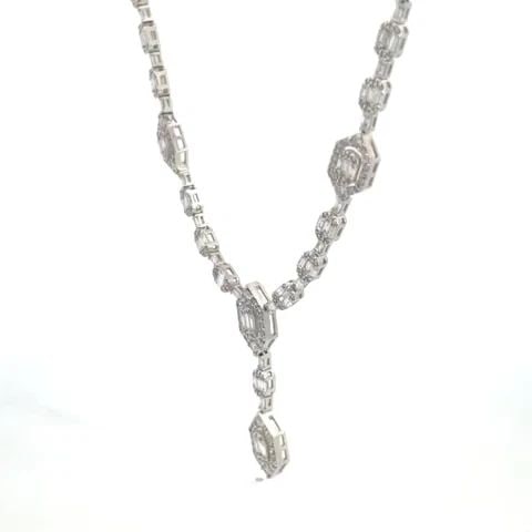 DIAMOND NECKLACE 14K WHITE GOLD BAGUETTE LARIAT NECKLACE NEW: DIAMOND NECKLACE 14K WHITE GOLD BAGUETTE LARIAT NECKLACE NEW The gorgeous NEW necklace is perfect for an evening attire. It is crafted from 14k white gold featuring a drop center lariat style with sma