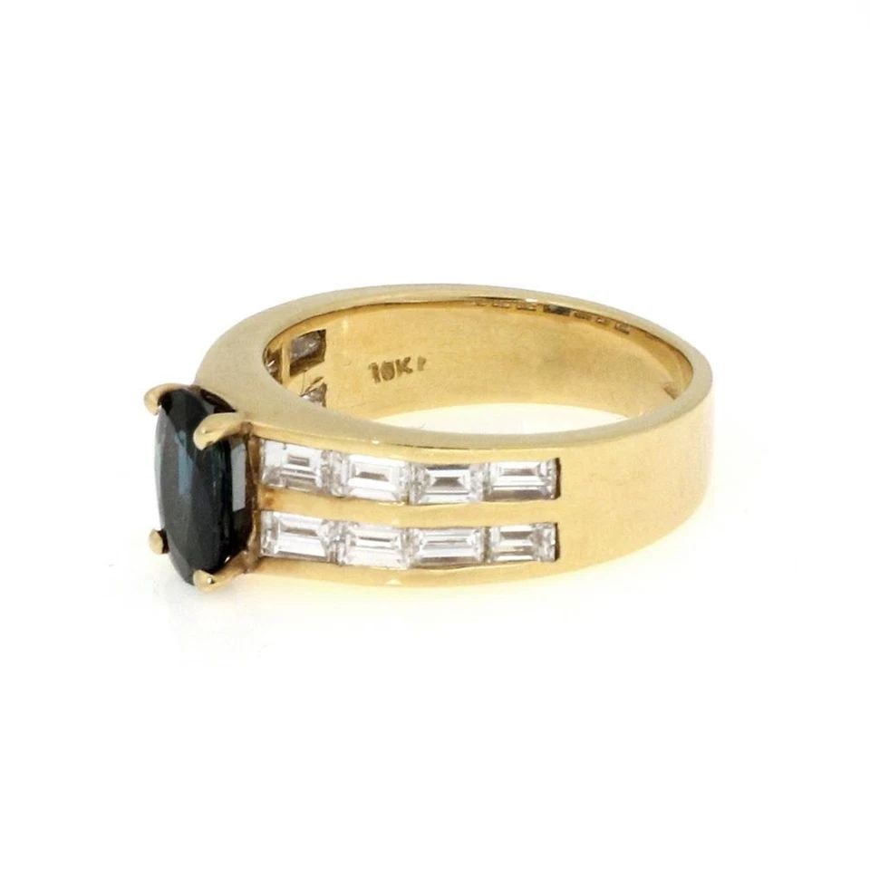 18K YELLOW GOLD DIAMOND & SAPPHIRE CHANNEL RING: 18K YELLOW GOLD DIAMOND & SAPPHIRE CHANNEL RING 18k Yellow Gold Diamond & Sapphire Channel Ring Description This elegant cocktail ring is crafted from 18k yellow gold featuring an oval shape sapphire 