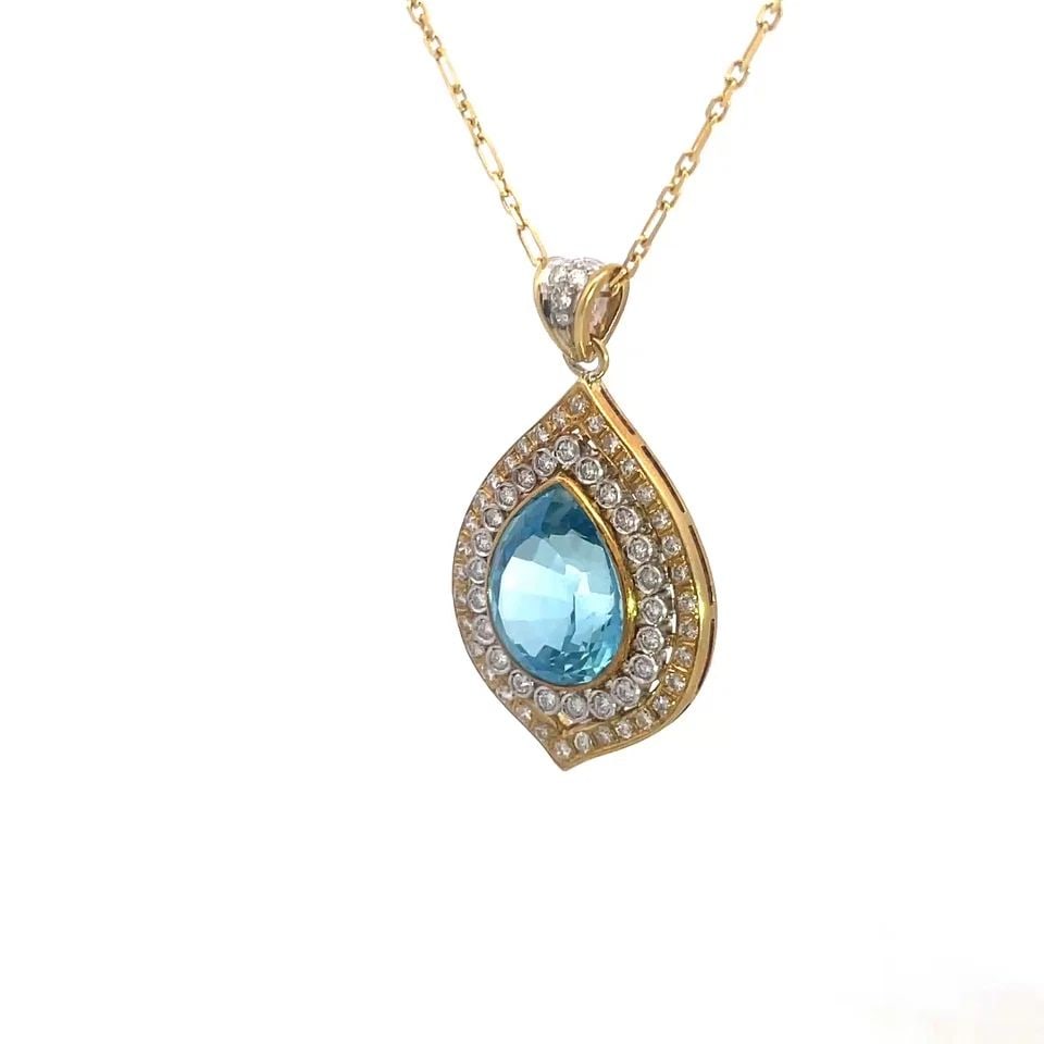 AQUAMARINE DIAMOND GOLD PENDANT 18K YELLOW 14K CHAIN PEAR SHAPE HALO STYLE: AQUAMARINE DIAMOND GOLD PENDANT 18K YELLOW 14K CHAIN PEAR SHAPE HALO STYLE This gorgeous necklace is a stunning piece of fine jewelry featuring an 18k yellow gold teardrop shaped pendant with a bezel 