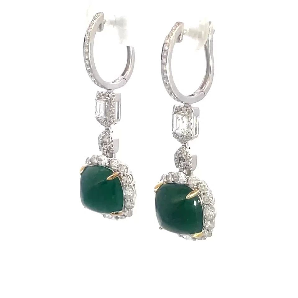 EMERALD DIAMOND GOLD EARRINGS 18K WHITE 6.5CT HALO DANGLE STYLE: EMERALD DIAMOND GOLD EARRINGS 18K WHITE 6.5CT HALO DANGLE STYLE These dangle earrings feature stunning pyramid style cabochon green, emerald gemstone set in yellow prongs with diamond halo cushion sha