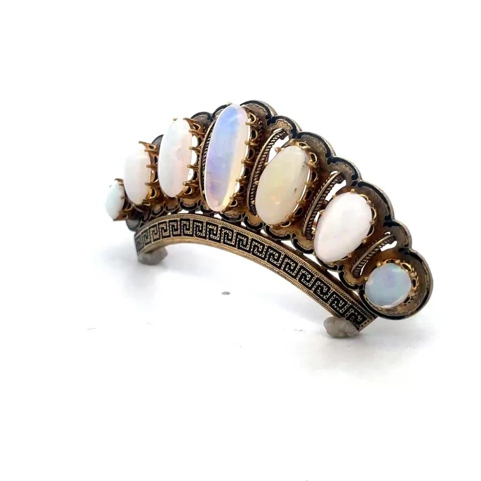 VICTORIAN GOLD OPAL BROOCH 18K YELLOW LARGE CURVED SHAPE ENAMEL DESIGN: This is a gorgeous Victorian Era piece that exudes classic elegance. Crafted from 18k yellow gold, this brooch features a stunning multicolor opal cabochon set in a prong setting, ensuring that it is 