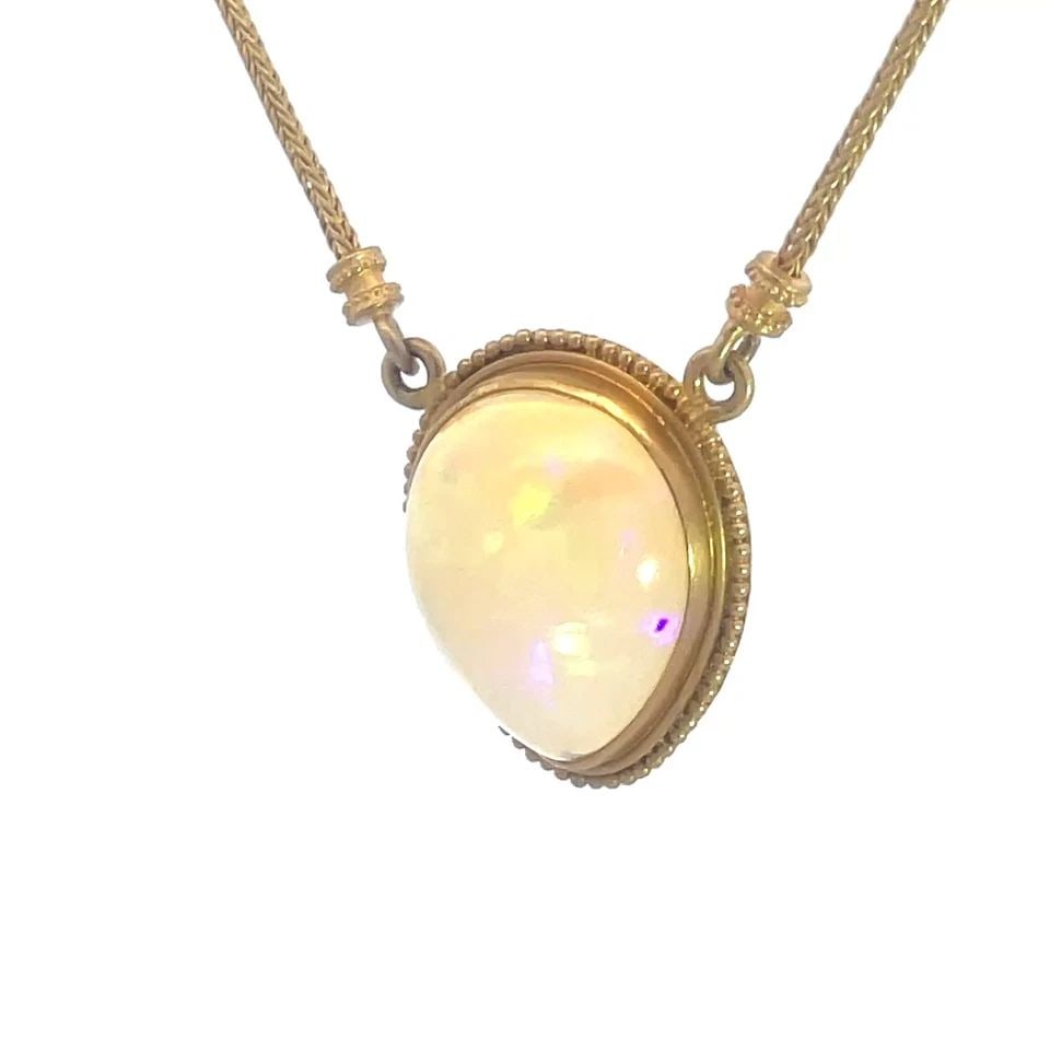 CAROLYN TYLER 22K GOLD NECKLACE GEMSTONE YELLOW PEAR PENDANT SPIGA CHAIN: CAROLYN TYLER 22K GOLD NECKLACE GEMSTONE YELLOW PEAR PENDANT SPIGA CHAIN This Carolyn Tyler 22k Gold Necklace features a stunning pear-shaped pendant with shimmering multicolor gemstone set in a bezel
