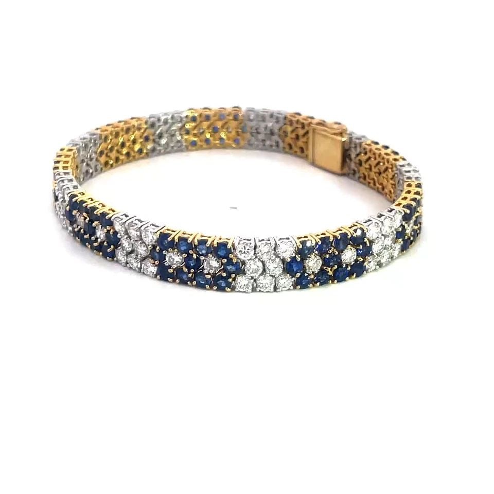 DIAMOND SAPPHIRE GOLD BRACELET 18K TWO TONE FLORAL WIDE FLEX LINK STYLE: This gorgeous diamond sapphire gold bracelet is a stunning piece of fine jewelry featuring a wide flex link style with a floral design. Made with natural white diamonds and sapphires set in 18k yellow