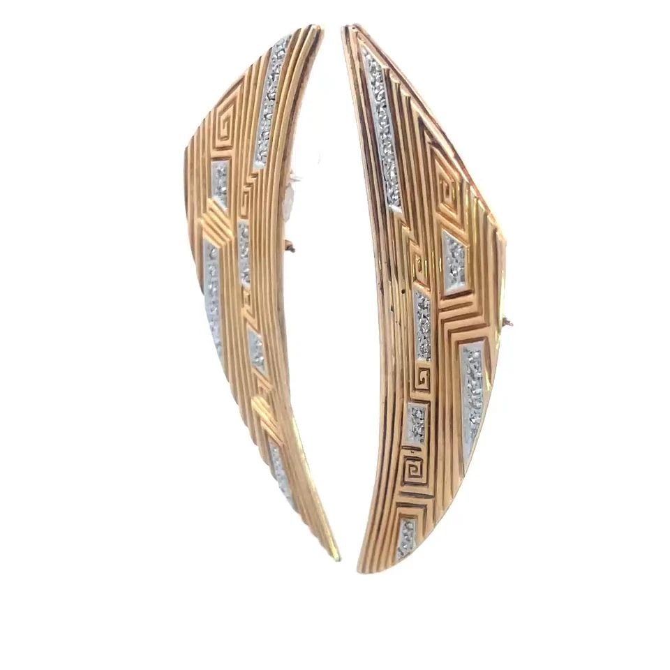 ERTE GOLD DIAMOND EARRINGS 14K TWO TONE LONG CURVED WING SHAPE: ERTE GOLD DIAMOND EARRINGS 14K TWO TONE LONG CURVED WING SHAPE This is a chic pair of Erte gold diamond earrings with a unique long curved wing shape and grooved lines. These 14k yellow gold with whit