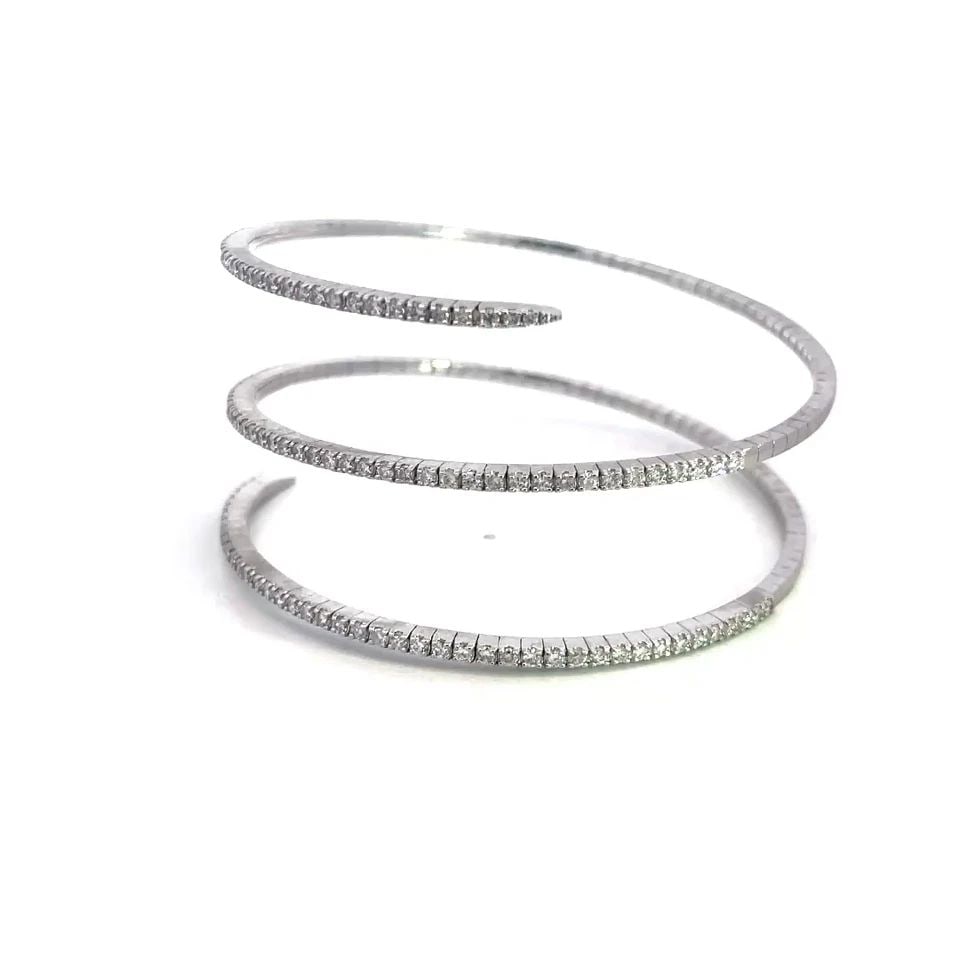 DIAMOND GOLD WRAP BRACELET 14K WHITE 3 ROW PRONG SET STYLE: DIAMOND GOLD WRAP BRACELET 14K WHITE 3 ROW PRONG SET STYLE This diamond wrap bracelet is a stunning piece of fine jewelry featuring a prong set style with 3-4ct of white diamonds. The bracelet is craf