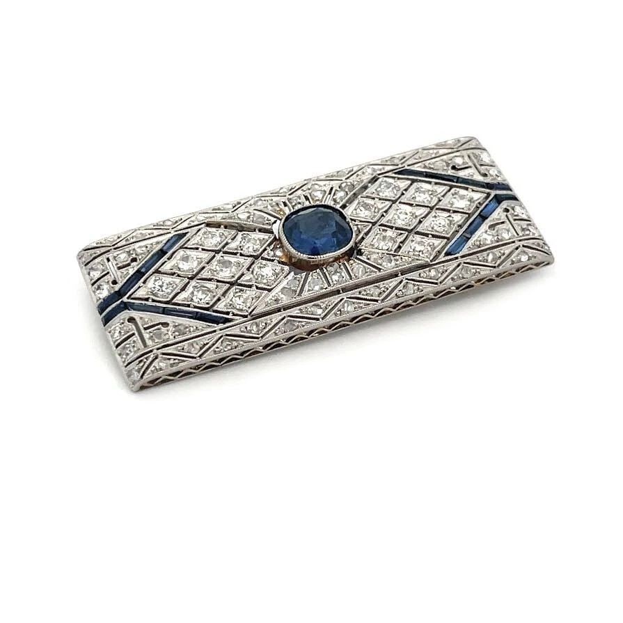 ART DECO DIAMOND BROOCH PLATINUM 18K GOLD SAPPHIRE RECTANGLE SHAPE: ART DECO DIAMOND BROOCH PLATINUM 18K GOLD SAPPHIRE RECTANGLE SHAPE This Art Deco brooch is crafted from platinum top with 18k white gold back and pin. it features a rectangle shape frame small rose cu