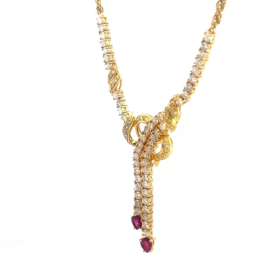DIAMOND RUBY GOLD NECKLACE 18K YELLOW LARIAT DANGLE STYLE: DIAMOND RUBY GOLD NECKLACE 18K YELLOW LARIAT DANGLE STYLE Elevate your jewelry collection with this gold necklace, it is a stunning piece of fine jewelry made with 18k yellow gold. The lariat style an