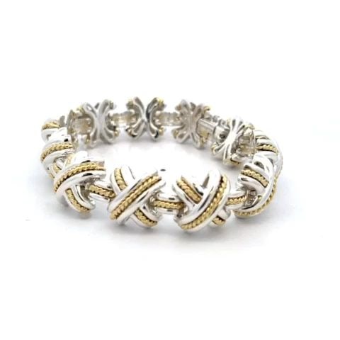 TIFFANY & CO. SIGNATURE X BRACELET STERLING SILVER 18K YELLOW GOLD 1990: TIFFANY & CO. SIGNATURE X BRACELET STERLING SILVER 18K YELLOW GOLD 1990 From the Signature X Collection by Tiffany & Co; this eye-catching bracelet is well crafted from sterling silver with 18k yellow