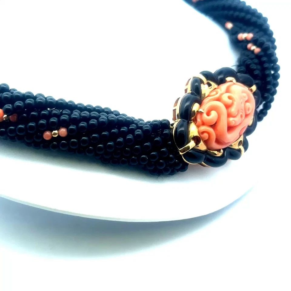 CORAL ONYX GOLD BEADED NECKLACE 18K DRAGON PENDANT/PIN 13 STRAND TORSADE: CORAL ONYX GOLD BEADED NECKLACE 18K DRAGON PENDANT/PIN 13 STRAND TORSADE This lovely eye-catching necklace has 13 strands of black onyx beads accented with sections of coral and 18k gold beads on each