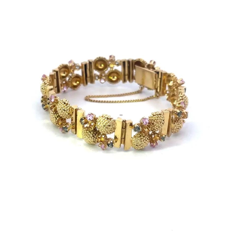 VINTAGE 1960'S GOLD BRACELET 14K YELLOW GEMSTONES SEA LIFE CORAL DESIGN: VINTAGE 1960'S GOLD BRACELET 14K YELLOW GEMSTONES SEA LIFE CORAL DESIGN This marine life vintage bracelet is crafted from 14k yellow gold featuring section links joined together by fine hinged pin. Ea