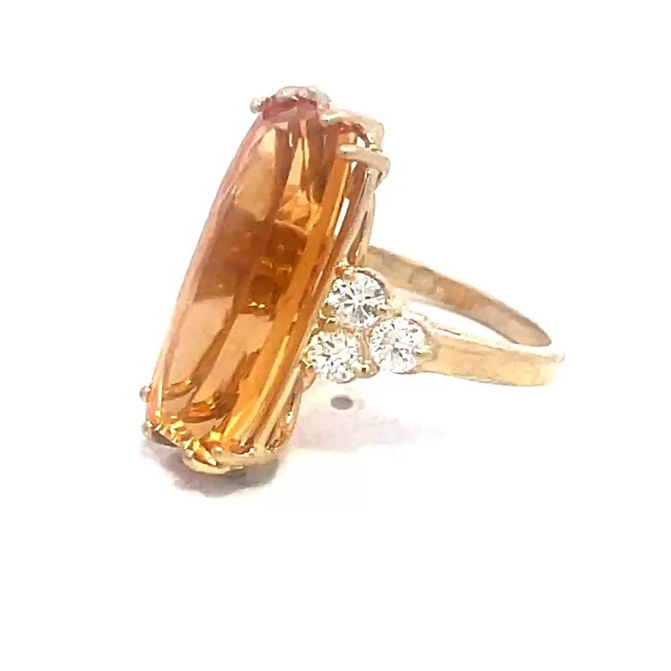 DIAMOND IMPERIAL TOPAZ GOLD RING 11.90CT LONG TOP 14K YELLOW COCKTAIL STYLE: DIAMOND IMPERIAL TOPAZ GOLD RING 11.90CT LONG TOP 14K YELLOW COCKTAIL STYLE This is a stunning Imperial Topaz and diamond gold ring, it features a long shaped yellow Imperial Topaz as the main stone a