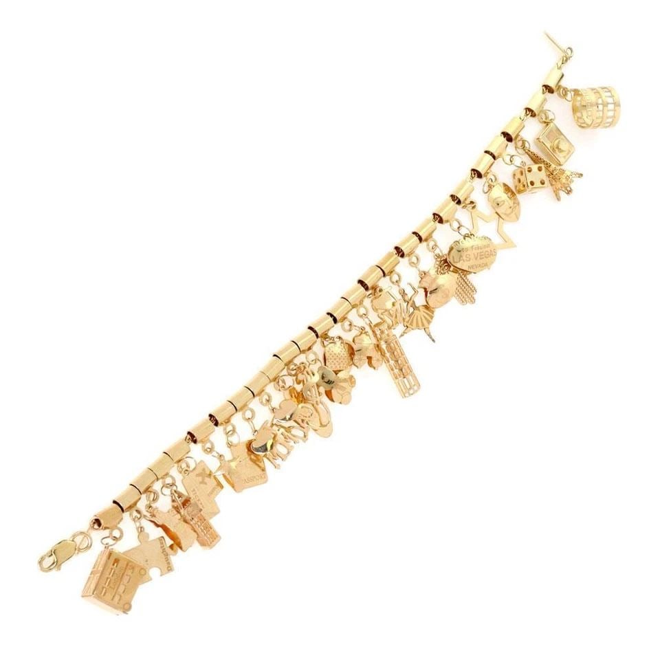 14K YELLOW GOLD MULTI-CHARMS CHAIN BRACELET LIQUIDATION!: 14K YELLOW GOLD MULTI-CHARMS CHAIN BRACELET ! 14k Yellow Gold Multi-Charms Chain Bracelet ! Description This is a multi dangling charms bracelet, it is crafted from 14k yellow gold featuring assorted 
