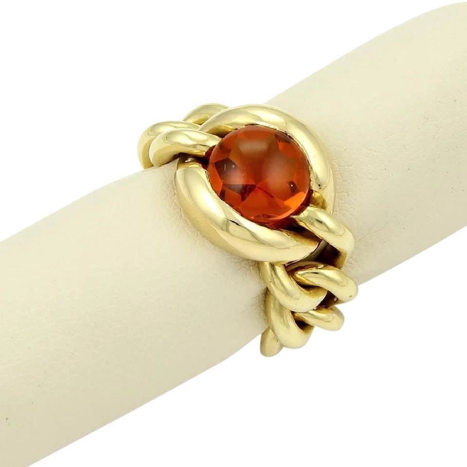 CHANEL YELLOW GOLD 18K 4CT CABOCHON CITRINE CHAIN LINK FLEX BAND RING: CHANEL YELLOW GOLD 18K 4CT CABOCHON CITRINE CHAIN LINK FLEX BAND RING Chanel Yellow Gold 18k 4ct Cabochon Citrine Chain Link Flex Band Ring Description This is a magnificent ring by Chanel, it is well