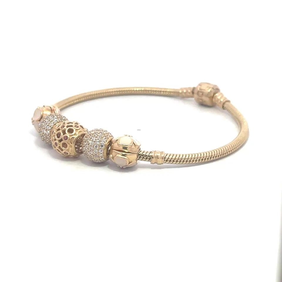 PANDORA ENAMEL GOLD BRACELET 14K YELLOW 5 CHARMS SNAKE CHAIN: PANDORA ENAMEL GOLD BRACELET 14K YELLOW 5 CHARMS SNAKE CHAIN This is an authentic bracelet by Pandora, it is crafted from 14k yellow gold featuring a 3mm thick snake chain band with 5 slide charms, tw