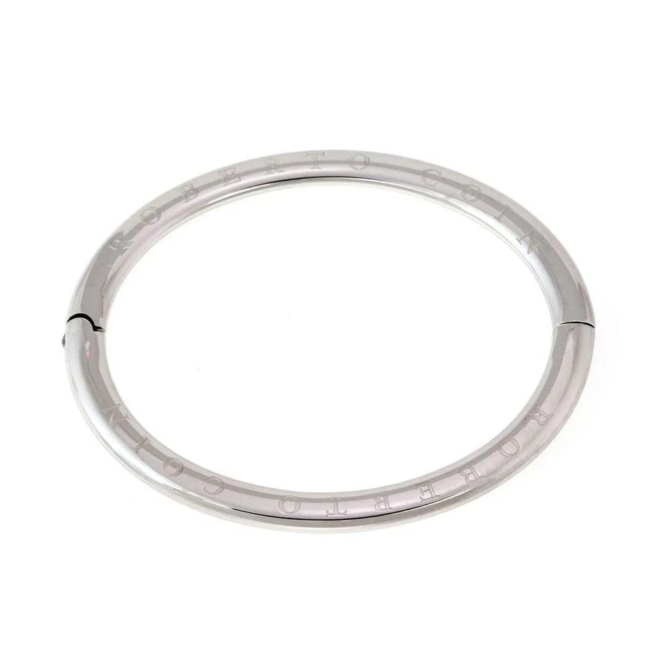 ROBERTO COIN 18K WHITE GOLD ENGRAVED HINGED BANGLE LIQUIDATION!: ROBERTO COIN 18K WHITE GOLD ENGRAVED HINGED BANGLE ! Roberto Coin 18k White Gold Engraved Hinged Bangle ! Description This is an authentic oval hinged bangle from Roberto Coin. Crafted from 18k white 